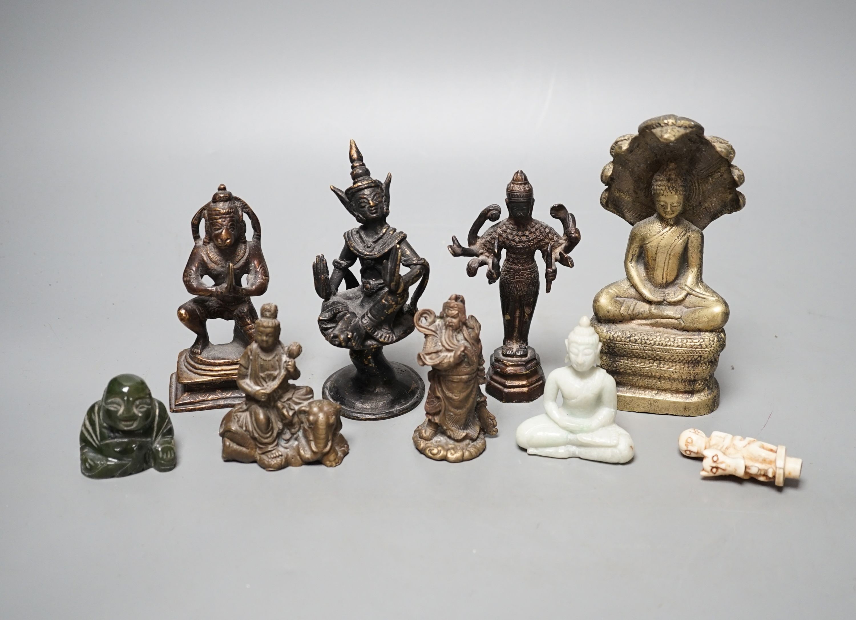 A quantity of Indian and South East Asian bronze and brass models of deities etc.
